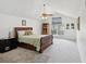 Spacious bedroom with vaulted ceiling, ceiling fan and bookcase at 92 Randolph Ave, Spring Hill, FL 34606