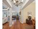 Hardwood floors, high ceilings, chandelier, and view into living room at 92 Randolph Ave, Spring Hill, FL 34606