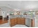 Modern kitchen island with granite countertop, sink, and dishwasher at 92 Randolph Ave, Spring Hill, FL 34606