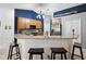 Modern kitchen boasts granite counters, stainless steel appliances, and blue accent wall at 92 Randolph Ave, Spring Hill, FL 34606
