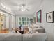 Living room with hardwood floors, sofas, and a view into the entryway at 92 Randolph Ave, Spring Hill, FL 34606