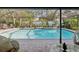 Relaxing screened-in pool area with patio furniture at 92 Randolph Ave, Spring Hill, FL 34606