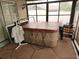 Covered hot tub on the back patio at 11187 Blythville Rd, Spring Hill, FL 34608