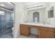 Double vanity bathroom with a large walk-in shower and separate toilet at 11644 Spindrift Loop, Hudson, FL 34667
