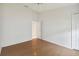 Bright bedroom with wood floors and access to a bathroom at 11644 Spindrift Loop, Hudson, FL 34667