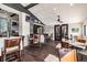 Bright clubhouse restaurant with tables, chairs, and a bar at 11644 Spindrift Loop, Hudson, FL 34667