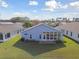 House exterior view with sunroom and AC unit at 11644 Spindrift Loop, Hudson, FL 34667