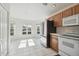 Bright kitchen nook with view of backyard and stainless steel refrigerator at 11644 Spindrift Loop, Hudson, FL 34667