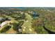 Scenic aerial view of the lush golf course winding through the community, complemented by a beautiful waterway at 121 Lindsay Ln # 31, Oldsmar, FL 34677