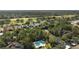 Aerial view showcasing the serene community with lush greenery, mature trees, and well-manicured landscaping at 121 Lindsay Ln # 31, Oldsmar, FL 34677