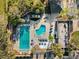 A vibrant community pool complex featuring multiple pools, a lounge area, and ample space for recreation and relaxation at 121 Lindsay Ln # 31, Oldsmar, FL 34677