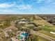 Scenic aerial view of golf course, pool, and lush landscapes in a beautiful community setting at 121 Lindsay Ln # 31, Oldsmar, FL 34677