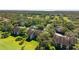 Beautiful aerial view of a condo complex surrounded by lush greenery and a golf course at 121 Lindsay Ln # 31, Oldsmar, FL 34677