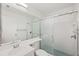 Bathroom with a shower, light blue tiles, and a single-sink vanity with ample counter space at 121 Lindsay Ln # 31, Oldsmar, FL 34677