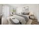 Comfortable bedroom featuring a queen size bed and ample natural light at 121 Lindsay Ln # 31, Oldsmar, FL 34677
