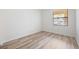 Bedroom featuring vinyl floor and a window at 121 Lindsay Ln # 31, Oldsmar, FL 34677