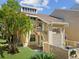 Inviting condo exterior features a well-maintained lawn and a private entrance at 121 Lindsay Ln # 31, Oldsmar, FL 34677