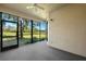 Enclosed patio featuring views of the lush greenery and scenic golf course at 121 Lindsay Ln # 31, Oldsmar, FL 34677