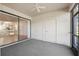 Screened patio with sliding glass doors and gray carpet flooring at 121 Lindsay Ln # 31, Oldsmar, FL 34677