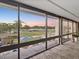 Expansive windows offer beautiful views of the golf course at sunset at 121 Lindsay Ln # 31, Oldsmar, FL 34677