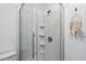 Bathroom with a walk-in shower and white subway tile at 1244 31St E Ave, Bradenton, FL 34208