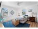Bright bedroom with a comfortable bed, blue rug, and decorative wall art at 1244 31St E Ave, Bradenton, FL 34208