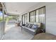 Relaxing deck features wicker couch and round table at 1244 31St E Ave, Bradenton, FL 34208