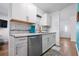 Modern kitchen with white cabinets and marble countertops at 1244 31St E Ave, Bradenton, FL 34208