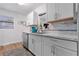 Modern kitchen with white cabinets and marble countertops at 1244 31St E Ave, Bradenton, FL 34208