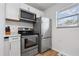 Stainless steel appliances and white cabinetry in kitchen at 1244 31St E Ave, Bradenton, FL 34208