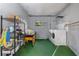 Laundry room with washer, dryer, and ample storage shelving at 1244 31St E Ave, Bradenton, FL 34208