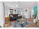 Bright living room featuring hardwood floors, comfy couch, and a coffee table at 1244 31St E Ave, Bradenton, FL 34208