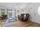Relaxing living room with hardwood floors, sliding doors to deck, and comfy seating at 1244 31St E Ave, Bradenton, FL 34208