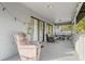 Relaxing covered porch with seating and wood flooring at 1244 31St E Ave, Bradenton, FL 34208
