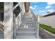 White wooden stairs leading to the home's entrance at 1244 31St E Ave, Bradenton, FL 34208