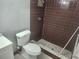 Bathroom with shower and toilet at 12804 Waterbury Ave, Hudson, FL 34669