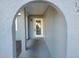 Arched entryway leading to the front door of the house at 12804 Waterbury Ave, Hudson, FL 34669