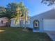 Charming one-story home with a well-maintained lawn and updated facade at 12804 Waterbury Ave, Hudson, FL 34669
