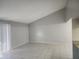Spacious living room with high ceilings and tile flooring at 12804 Waterbury Ave, Hudson, FL 34669