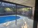 Refreshing screened-in pool in backyard at 12804 Waterbury Ave, Hudson, FL 34669