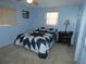 Cozy bedroom with a star patterned quilt and nightstand at 4392 Craftsbury Dr, New Port Richey, FL 34652