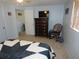 Bright bedroom featuring a dresser, rocking chair, and TV at 4392 Craftsbury Dr, New Port Richey, FL 34652