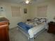 Well-lit bedroom with a comfortable bed and window coverings at 4392 Craftsbury Dr, New Port Richey, FL 34652