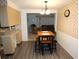 Small dining area with four-person table and seating at 4392 Craftsbury Dr, New Port Richey, FL 34652