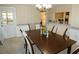 Dining room with table and chairs, view into kitchen at 4392 Craftsbury Dr, New Port Richey, FL 34652