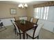 Formal dining room with wood table and six chairs at 4392 Craftsbury Dr, New Port Richey, FL 34652