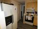 Kitchen with refrigerator, stove and ample cabinetry at 4392 Craftsbury Dr, New Port Richey, FL 34652