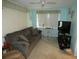 Living room with comfortable seating and large TV at 4392 Craftsbury Dr, New Port Richey, FL 34652