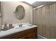 Bathroom with a vanity, oval mirror, and bathtub at 4808 Vesper Ct, New Port Richey, FL 34655