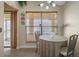 Bright breakfast nook with table and chairs, overlooking the backyard at 4808 Vesper Ct, New Port Richey, FL 34655